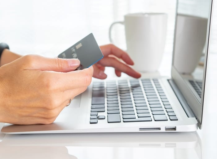 Business owner using credit card to get marketing services started